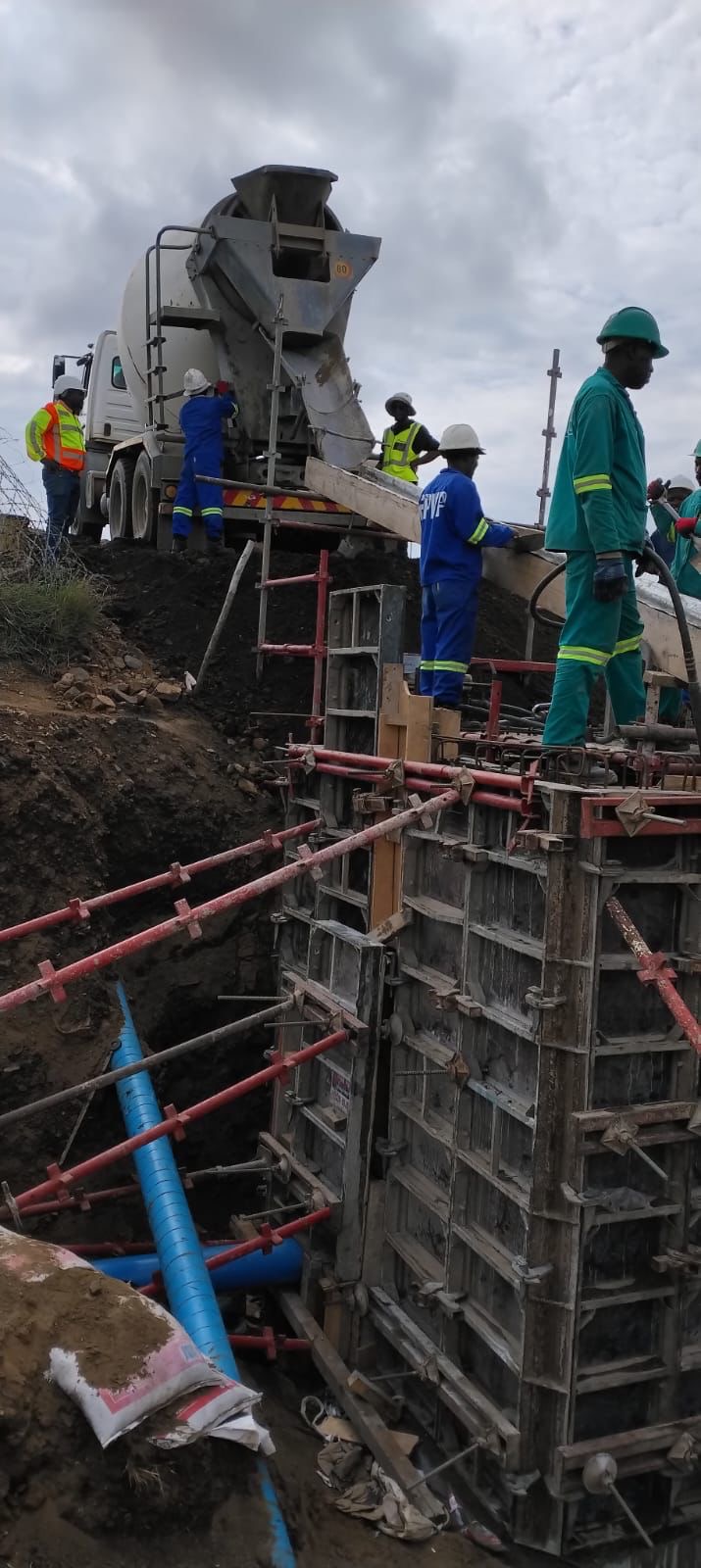 Concrete pour with cement truck and formwork on site