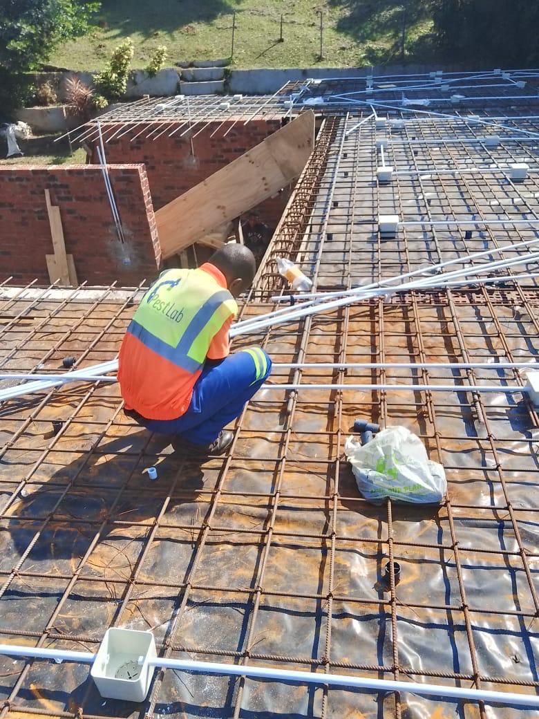 Worker on rebar mesh preparing slab