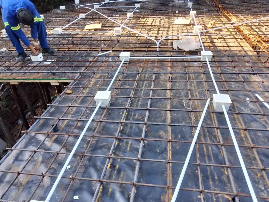 Rebar mesh with electrical conduit laid in slab