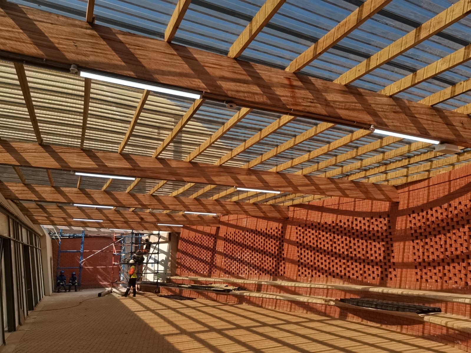Timber roof structure with decorative brickwork
