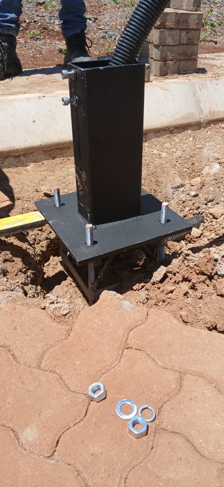 Close-up of pole base installation