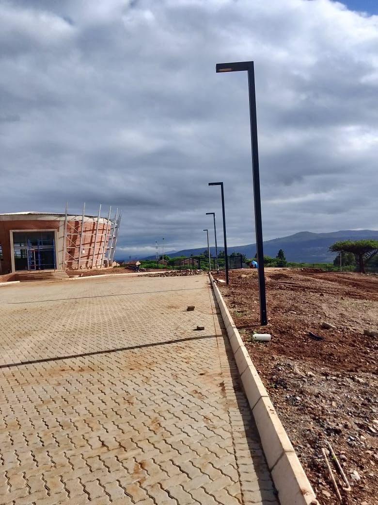 Row of light poles at facility entrance